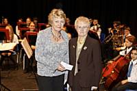 Sue Verity receives cheque from Mrs Maureen Cooper MBE